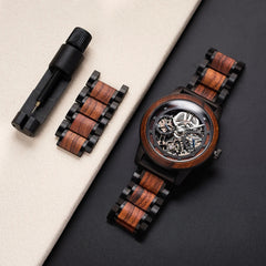 Wooden watch with mechanical components on a dark surface